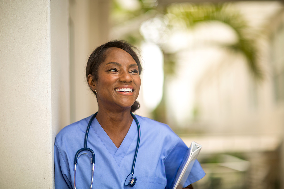 A woman working as a health care provider.