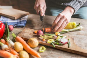 Woman Chopping healthy food ingredients
