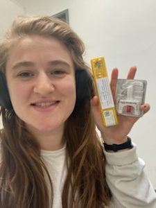 Juliet holding a naloxone kit