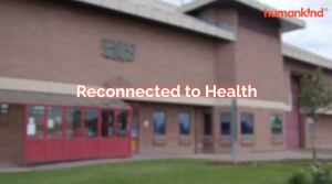 Blurred out photo of HMP Frankland with Reconnected to Health written over the top.