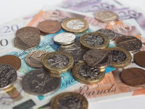 An image of pound coins and banknotes